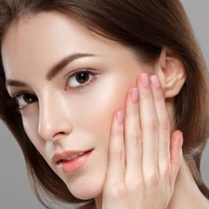 Close up of women clasping her face with hand